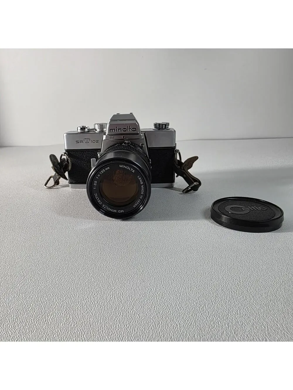 Minolta SRT 102 SLR Film Camera W/135mm MD Celtic f/3.5 Telephoto Lens